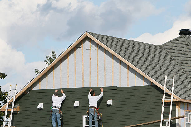 Professional Storm Damage Siding Repair technician working in Wayland, MA